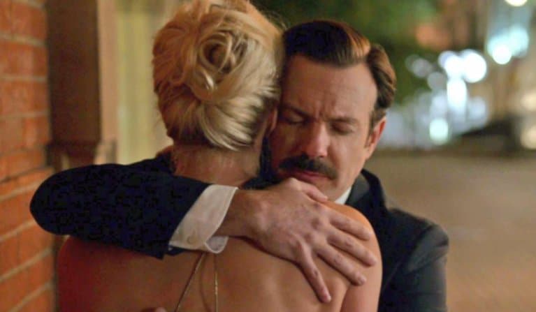 Ted Lasso proves the importance of empathy in brand storytelling, Above, Ted hugs Rebecca during an episode of the show.